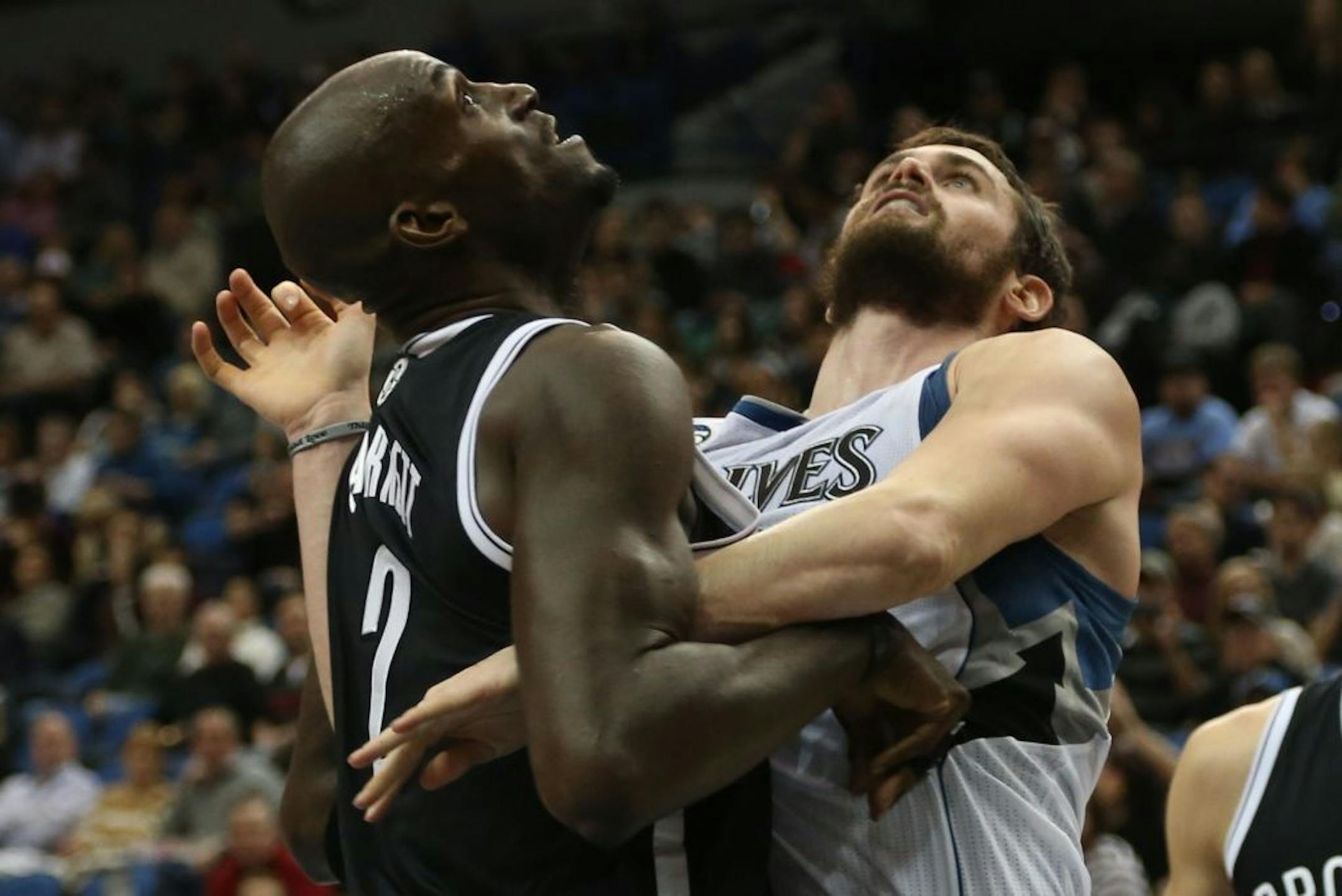 Wolves forward Kevin Love (right) and Nets forward Kevin Garnett fought for position under the basket during the first half at Target Center on Friday.