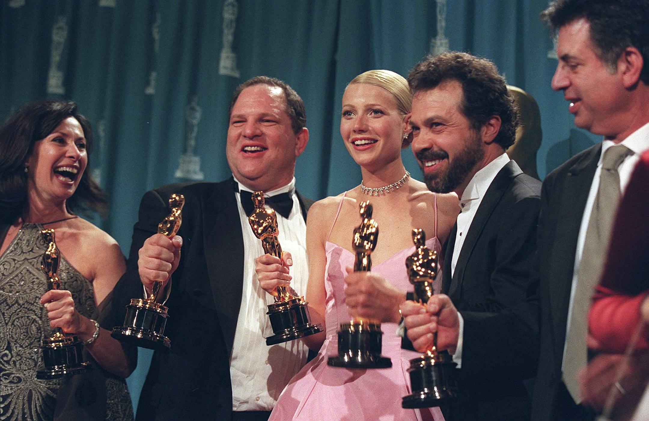 Harvey Weinstein, second from left, celebrates alongside the actress Gwynneth Paltrow and other producers of "Shakespeare in Love" after their film won the best picture Oscar, in Los Angeles, March 22, 1999. Paltrow and other actresses have come out to accuse the producer Harvey Weinstein of casting-couch abuses. Paltrow said very few people knew about Weinstein's advances on her more than 20 years ago. "I was expected to keep the secret," she said in October, 2017.