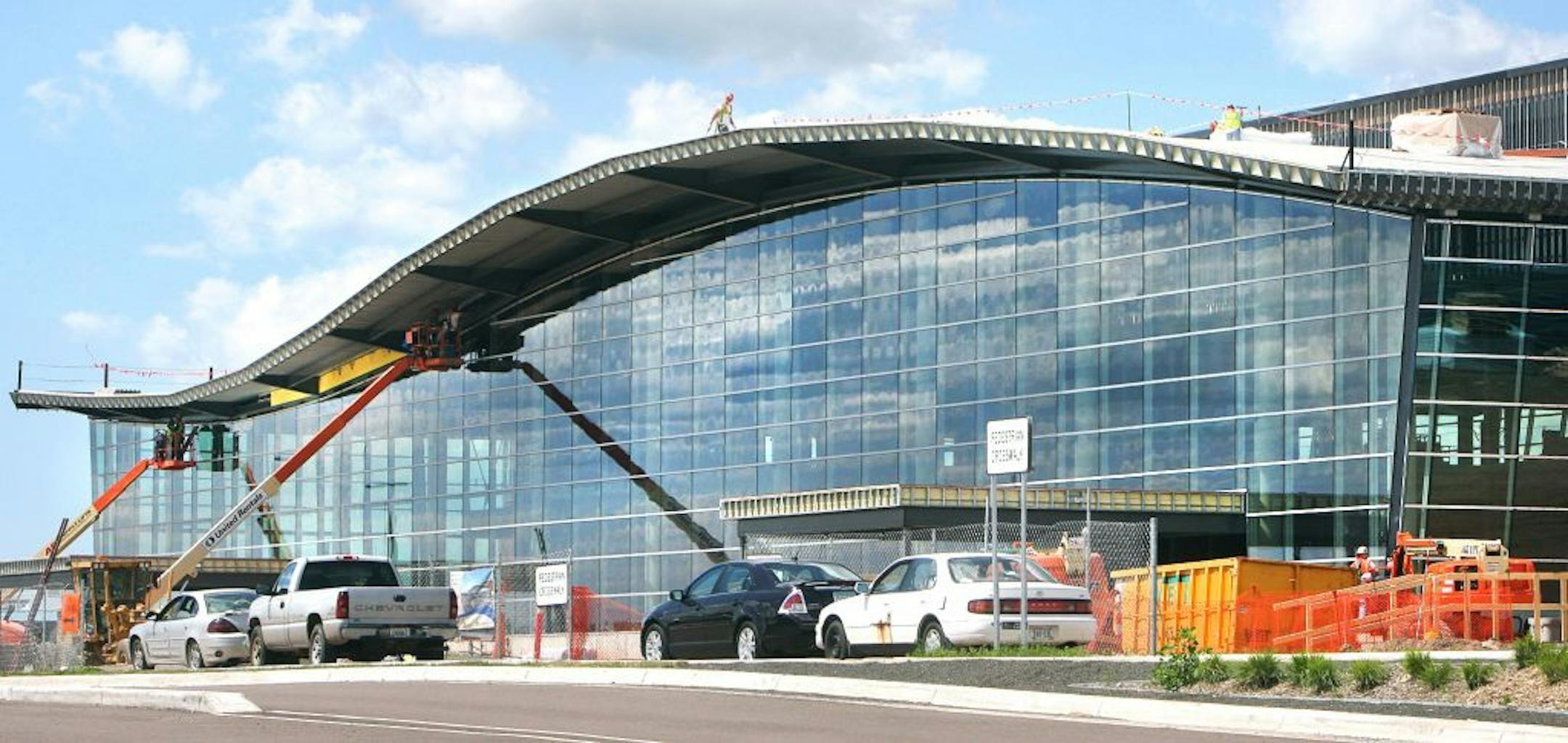 t7.25.11 Bob King -- kingFAA0726c1 -- Construction workers continue work on the new terminal at the Duluth International Airport Monday afternoon. The Duluth Airport Authority will continue its efforts to keep the project going by drawing on a $4 million line of credit, if necessary.