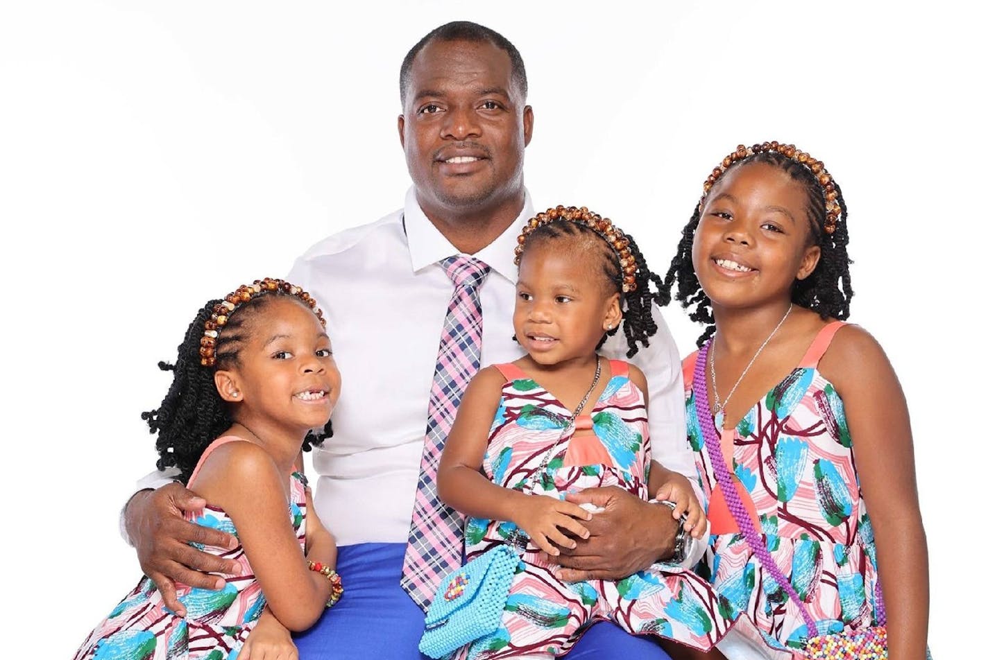 Thomas Tapeh and his daughters Jacqui, Jaime and Janae. Family photo