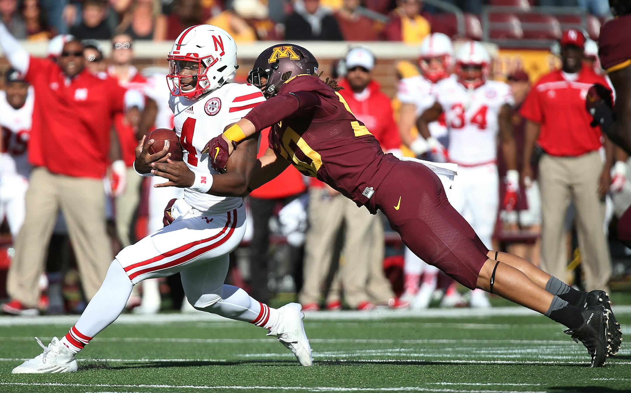 Nebraska's quarterback Tommy Armstrong Jr. is tackled by Minnesota's linebacker Jack Lynn in the third quarter as the Gophers took on Nebraska at TCF Bank Stadium, Saturday, October 17, 2015 in Minneapolis, MN. ] (ELIZABETH FLORES/STAR TRIBUNE) ELIZABETH FLORES • eflores@startribune.com