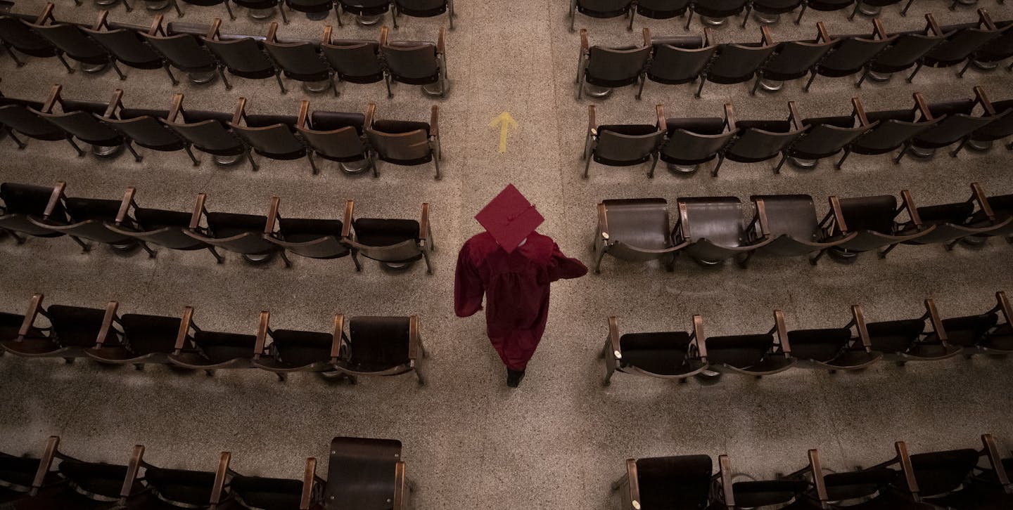 Denfeld graduating senior Ryan Strauduhar walked into the Denfeld auditorium on Wednesday May 13 to walk across the stage for his slice of the graduation ceremony. Stauduhar is headed to the University of Minnesota in the fall. ] ALEX KORMANN • alex.kormann@startribune.com Denfeld Duluth High School is holding a modified version of graduation over the course of four days from May 12-15. Each day approximately 50 students are invited to enter the school one at a time to walk across the stage, hav