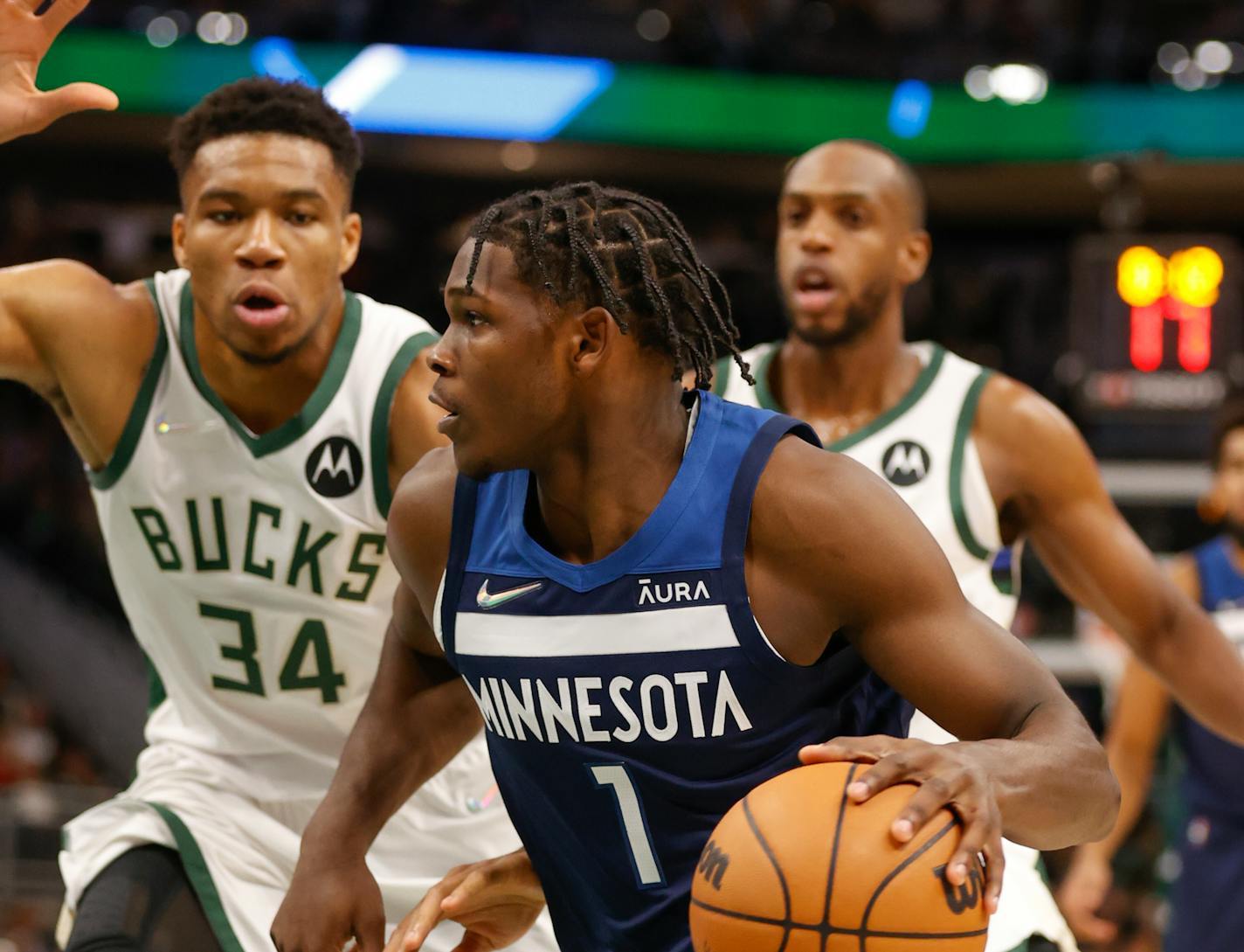 Timberwolves forward Anthony Edwards drives against Bucks forward Giannis Antetokounmpo during the first half