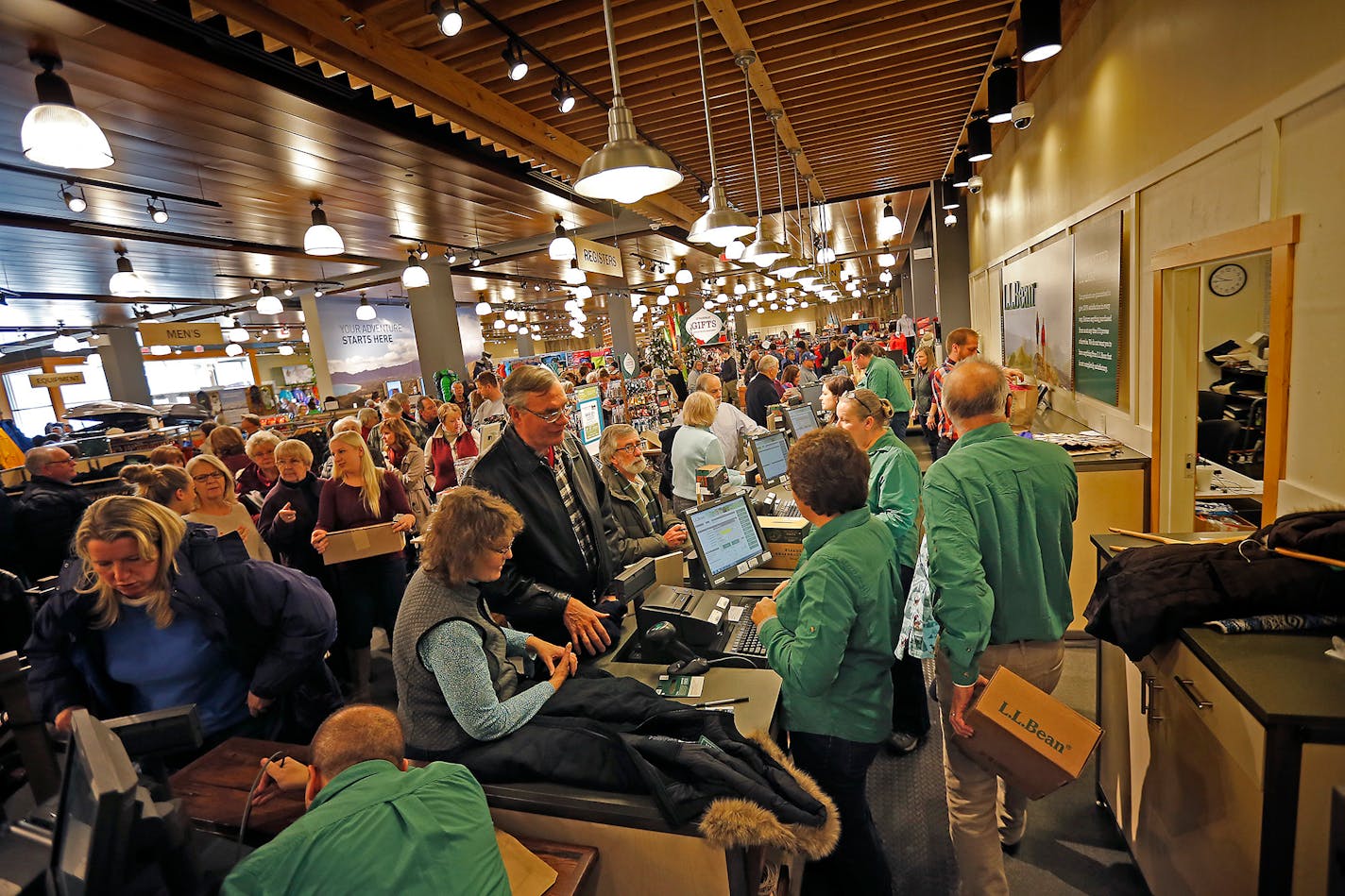 L.L. Bean employees waited on the hundreds of people who shopped at the newly opened L.L. Bean store at the Mall of America, Friday, November 14, 2014 in Bloomington, MN.