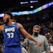 Minnesota Timberwolves center Karl-Anthony Towns (32) encourages the fans to shout at the referee after getting a technical foul in the third quarter.