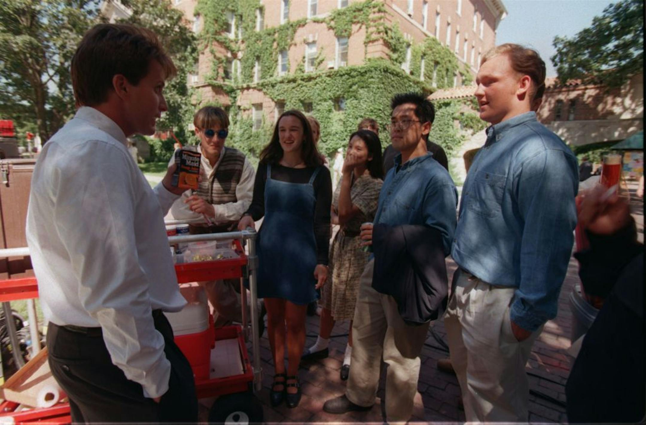Emilio Estevez, left, chats with young local extras during a break in the filming of Mighty Ducks III at St. Catherine University in St. Paul