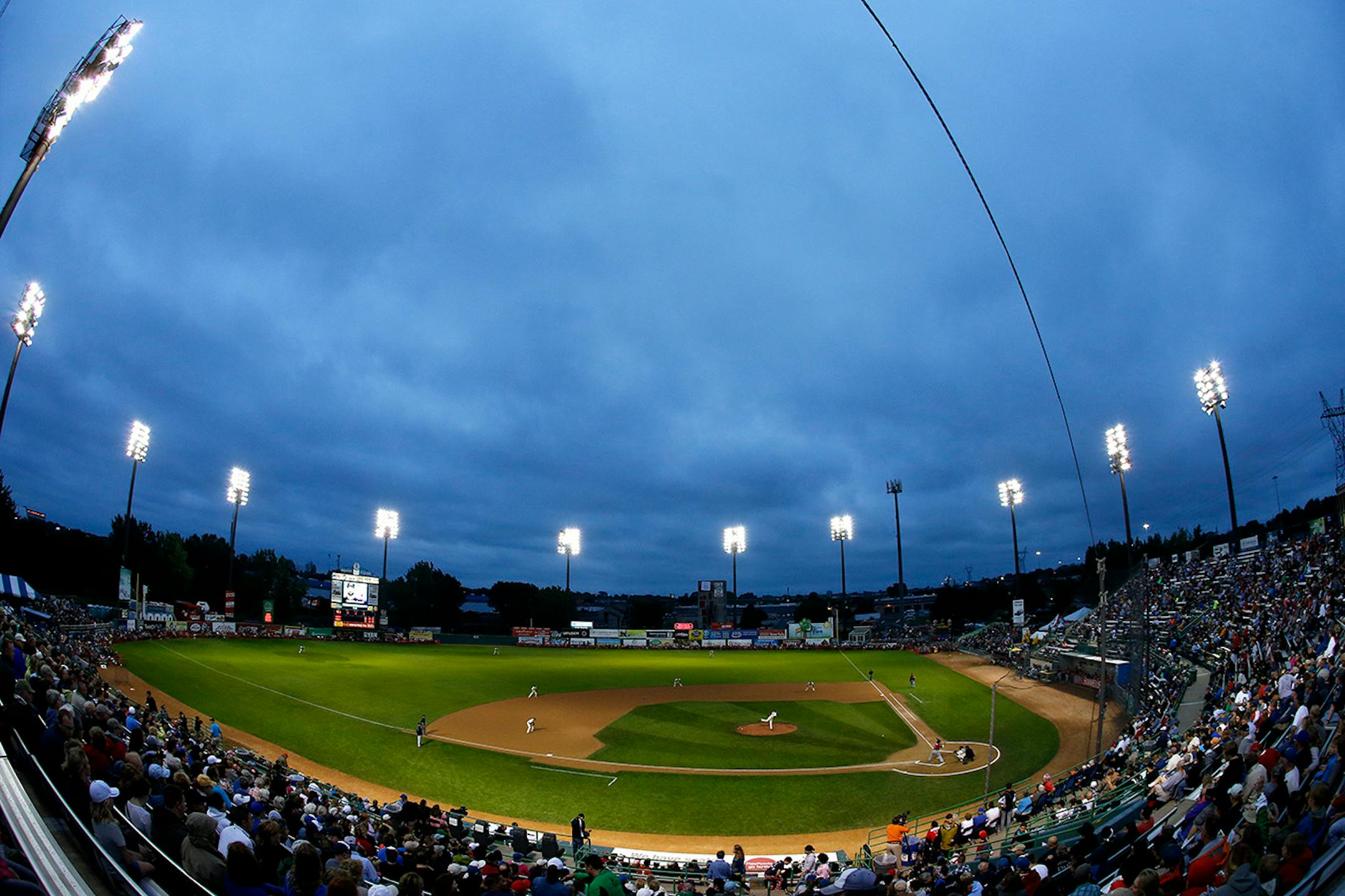 Fans in the stands watched the first inning of the St. Paul Saints final game at Midway Stadium on Thursday night. ] CARLOS GONZALEZ cgonzalez@startribune.com - August 28, 2014, St. Paul, Minn., Midway Stadium, St. Paul Saints baseball vs. Winnipeg - Final Saints game at Midway Stadium