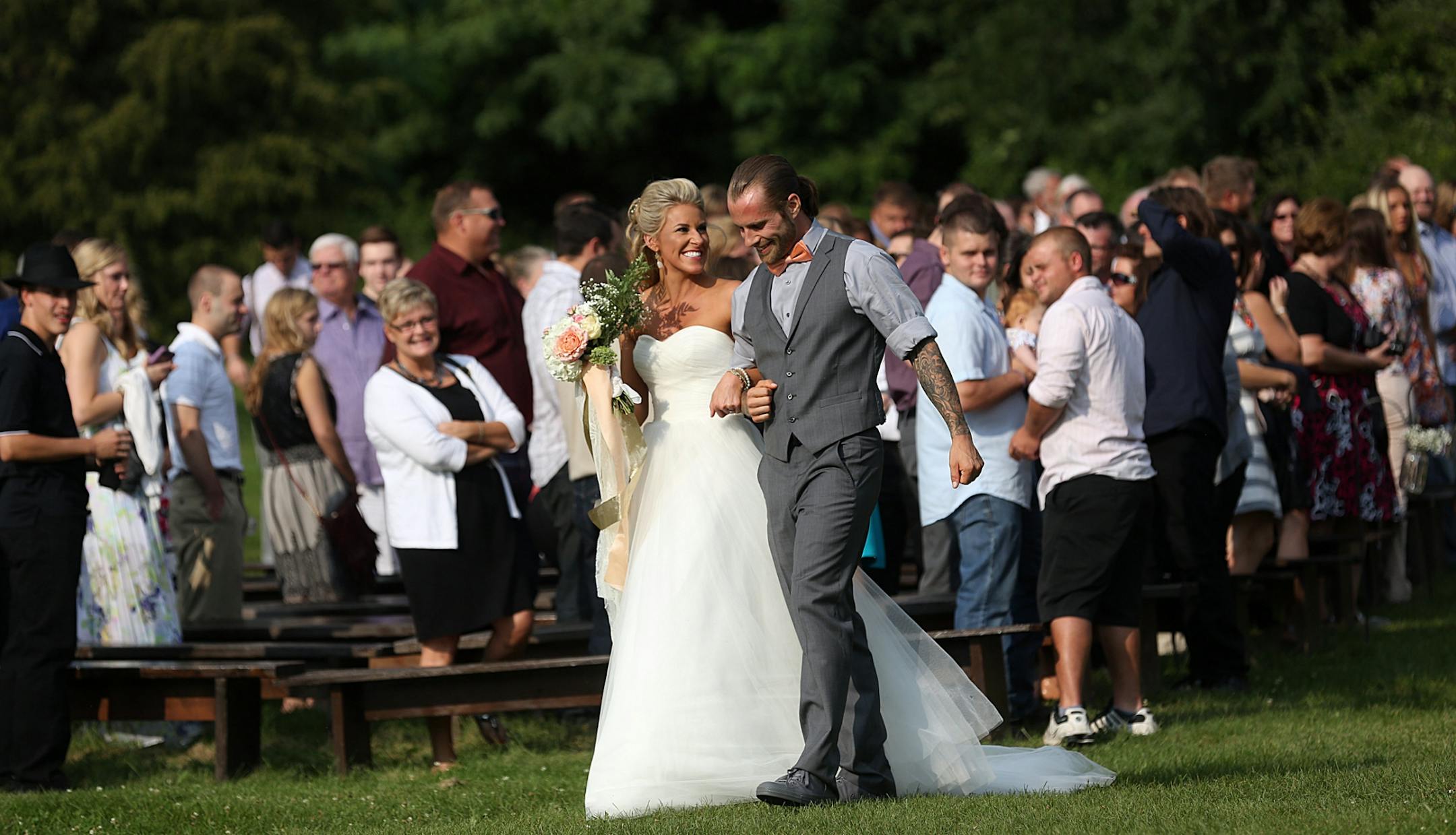 Newlyweds Savannah and Jeremy Eckert were greeted by friends and family following the ceremony.
