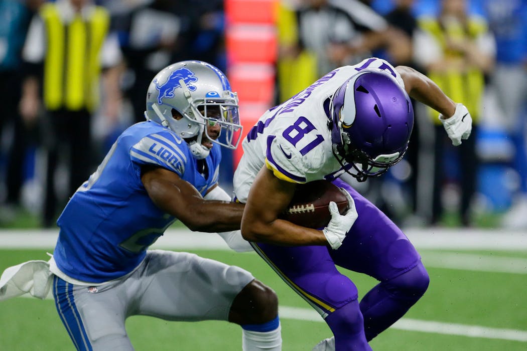 Minnesota Vikings wide receiver Olabisi Johnson is stopped by Detroit Lions cornerback Rashaan Melvin during the second half on Sunday.