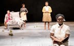 Brittany Bellizeare (Pecola), Carla Duren (Claudia), Regina Marie Williams (Mama) and Deonna Bouye (Frieda) in the Guthrie Theater&#xed;s production o