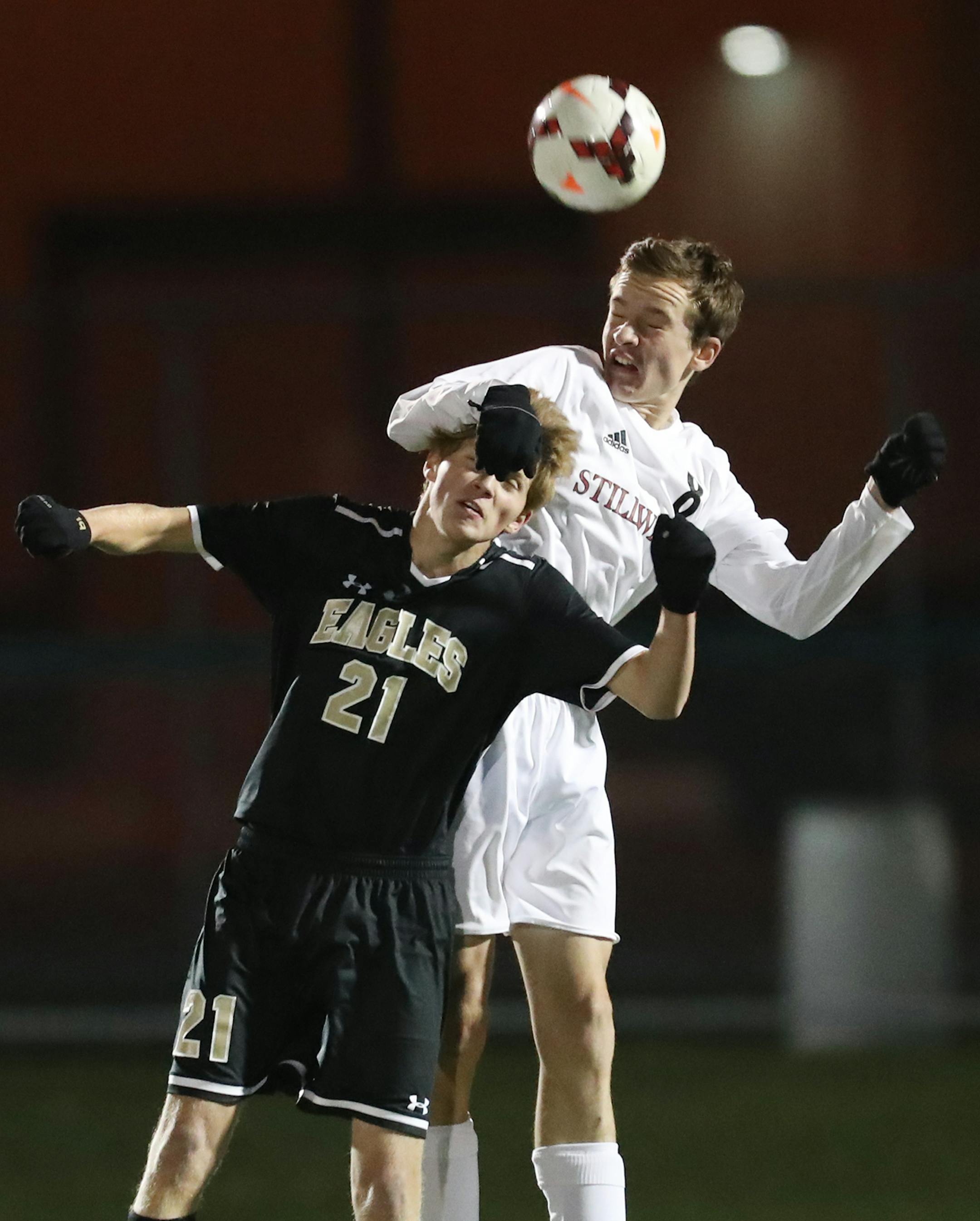 Apple Valley forward Kaden Westendorf (21) and Stillwater defender Chester Hearne (8) battle for the ball during the second half. ] LEILA NAVIDI ï leila.navidi@startribune.com BACKGROUND INFORMATION: Apple Valley High School plays Stillwater High School in the class 2A boys state soccer finals at Chisago Lakes High School in Lindstrom on Wednesday, October 25, 2017. Stillwater won the game 2-0.