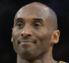 Los Angeles Lakers guard Kobe Bryant walks up court during the second half of an NBA basketball game against the San Antonio Spurs, Saturday, Feb. 6, 