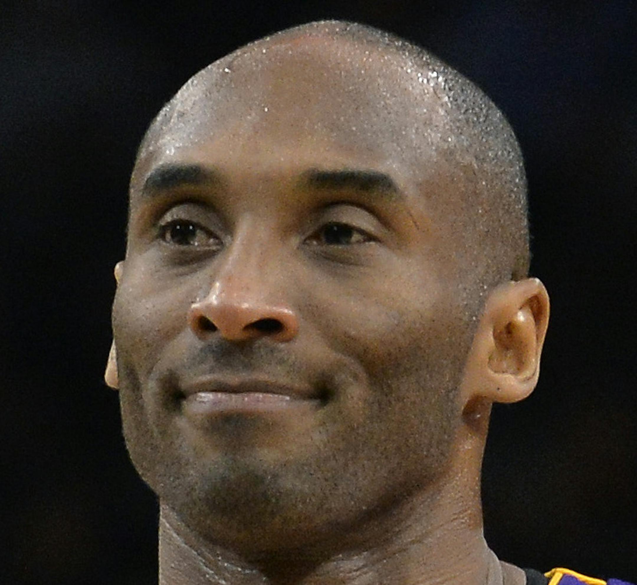 Los Angeles Lakers guard Kobe Bryant walks up court during the second half of an NBA basketball game against the San Antonio Spurs, Saturday, Feb. 6, 2016, in San Antonio. San Antonio won 106-102. (AP Photo/Darren Abate)