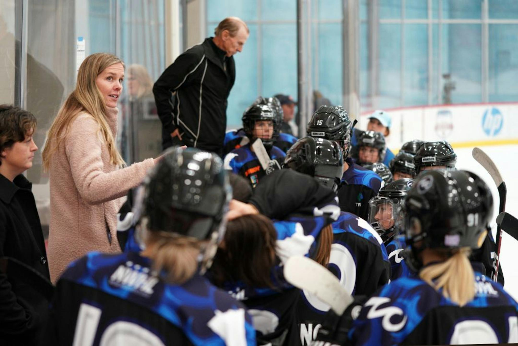 Whitecaps co-head coach Ronda Curtin Engelhardt talked with her players on the bench during Saturday's game.
