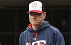 Minnesota Twins manager Paul Molitor looks over to the Detroit Tigers bench in the first inning of a baseball game, Sunday Oct. 1, 2017, in Minneapoli