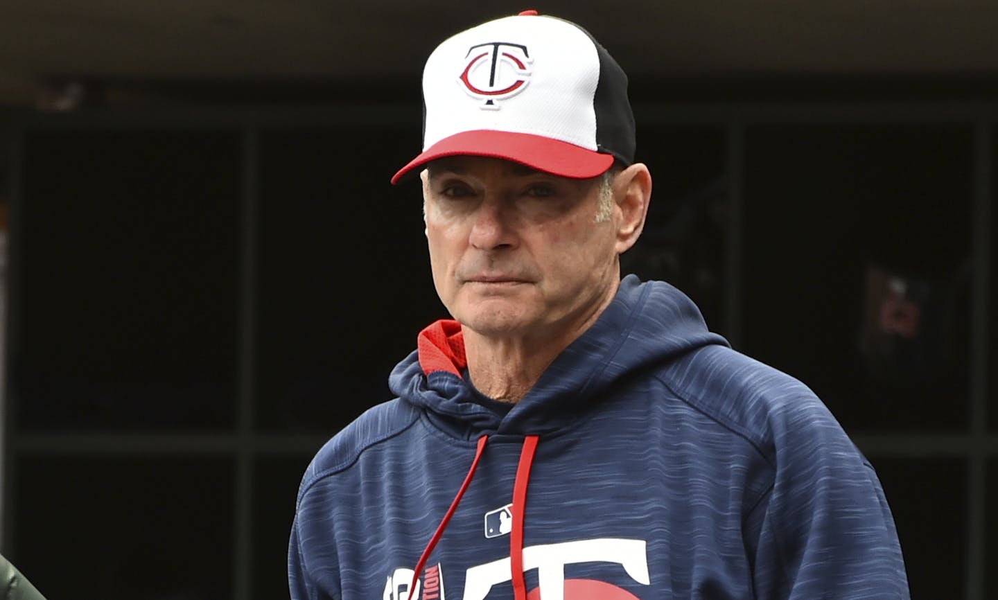 Minnesota Twins manager Paul Molitor looks over to the Detroit Tigers bench in the first inning of a baseball game, Sunday Oct. 1, 2017, in Minneapolis. (AP Photo/John Autey)