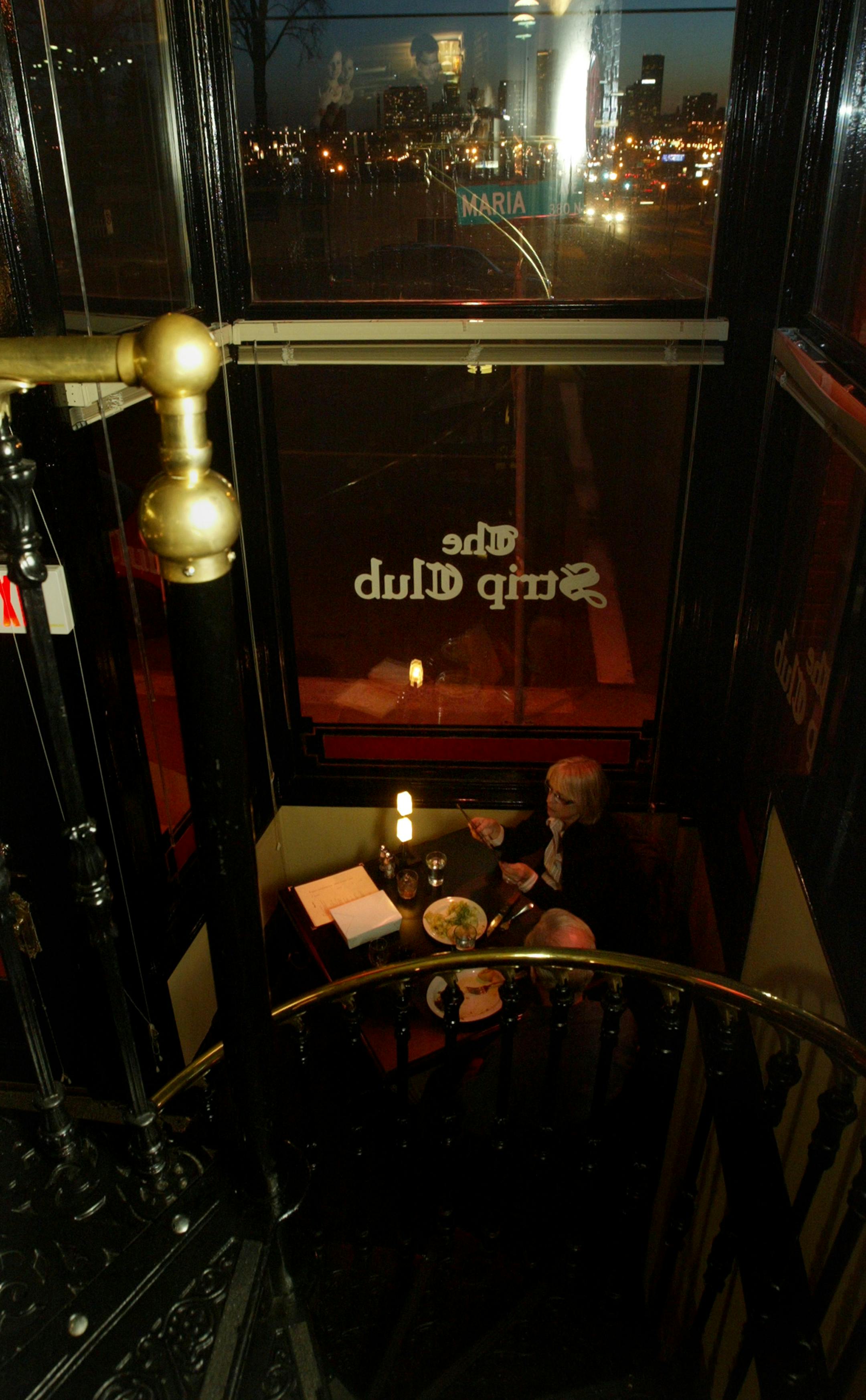 Gerry Flannery and Jean Henjum ate at sunset under the spiral staircase.