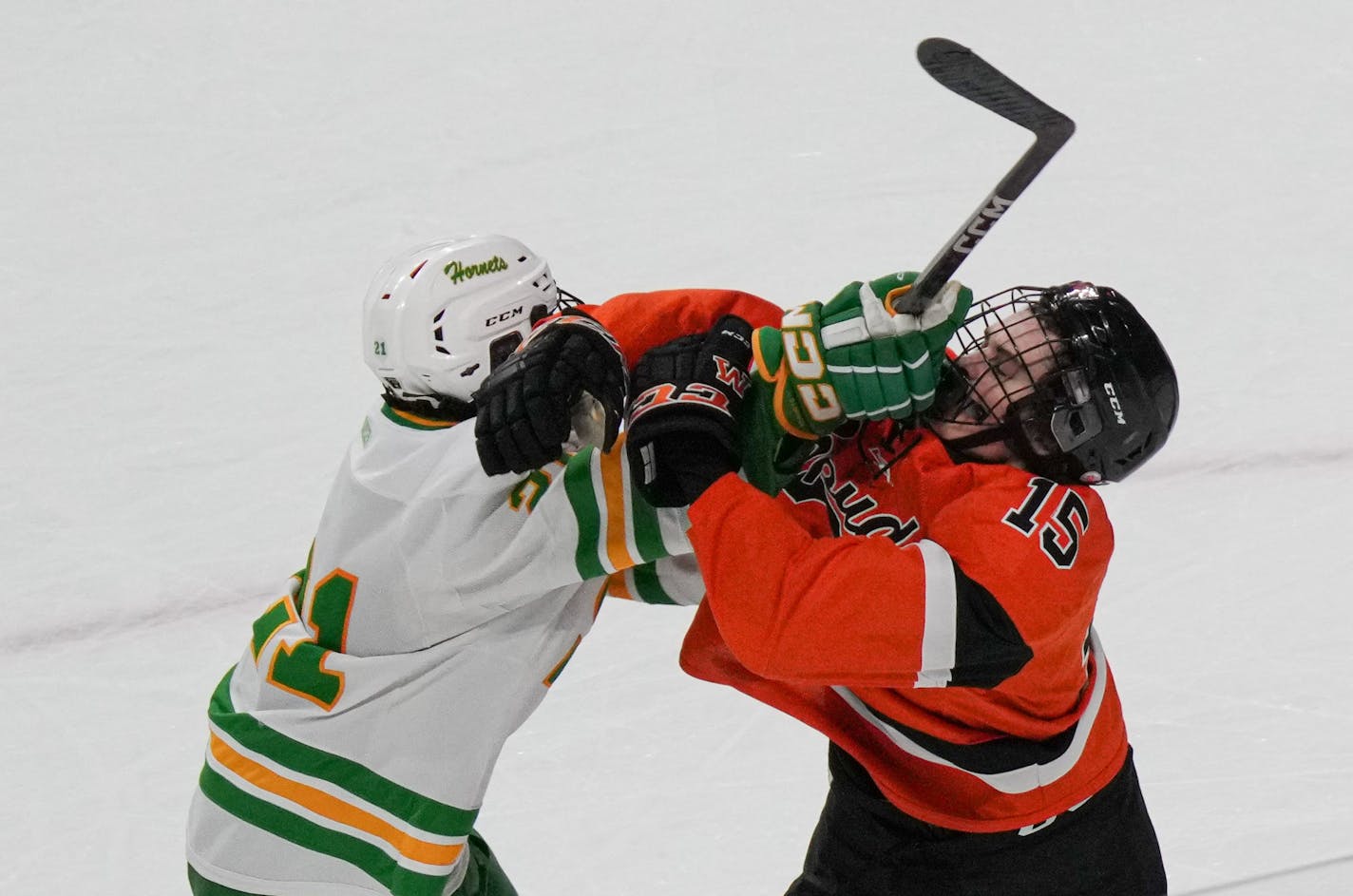 Edina forward Bobby Cowan (21) and Moorhead defenseman Jack Arnold (15) mixed it up in the end of the second period of a MSHSL Class 2A quarterfinal hockey game between Moorhead and Edina Thursday, March 9, 2023 St. Paul, Minn. Thursday, March 9, 2023 St. Paul, Minn. ] GLEN STUBBE • glen.stubbe@startribune.com