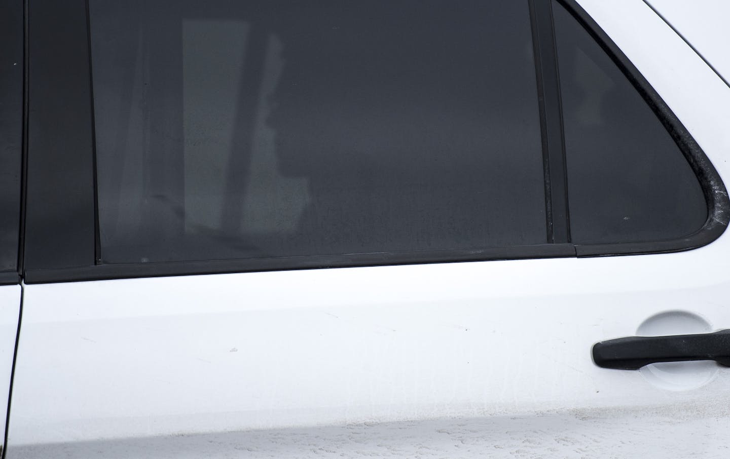 The profile of John Ladue is silhouetted in the back of an SUV as he is transported from the Waseca County Jail to an undisclosed state facility Thursday afternoon. ] (AARON LAVINSKY/STAR TRIBUNE) aaron.lavinsky@startribune.com John Ladue is escorted from the Waseca County Jail to an undisclosed state facility on Thursday, Jan. 28, 2016 in Waseca, Minn.