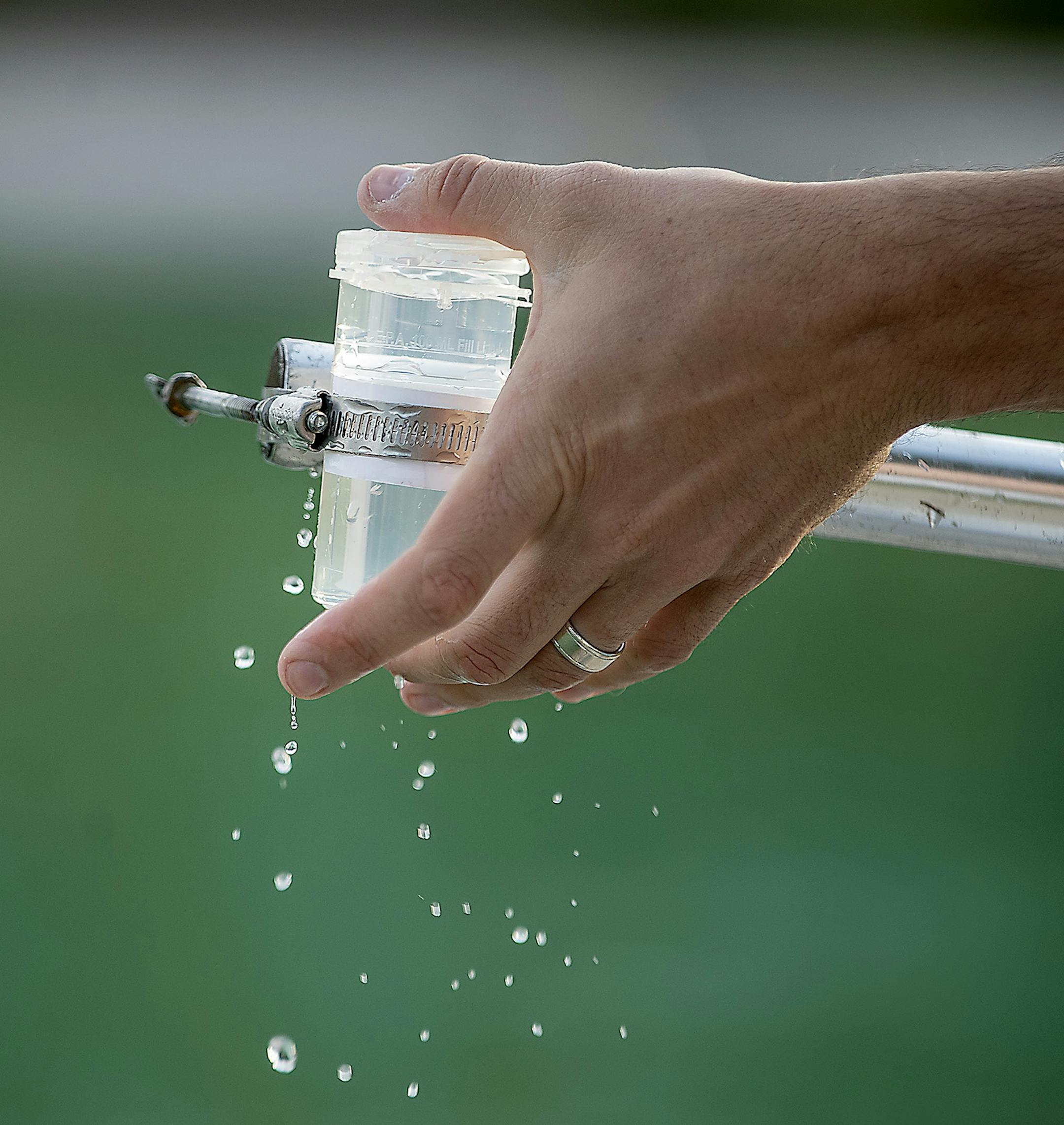 Robert Brown, a water resource specialist for the Minneapolis Park Department, tested the water at Webber Park Pool, Thursday, July 5, 2018 in Minneapolis, MN. Webber Pool's natural filtration system can't seem to keep the bacteria out of the water. The pool has been closed for multiple stretches this summer. The pool opened two years late and way over budget in 2015. ] ELIZABETH FLORES &#xef; liz.flores@startribune.com