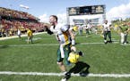 North Dakota State quarterback Carson Wentz runs off the field after their 34-14 win over Iowa State in an NCAA college football game, Saturday, Aug. 