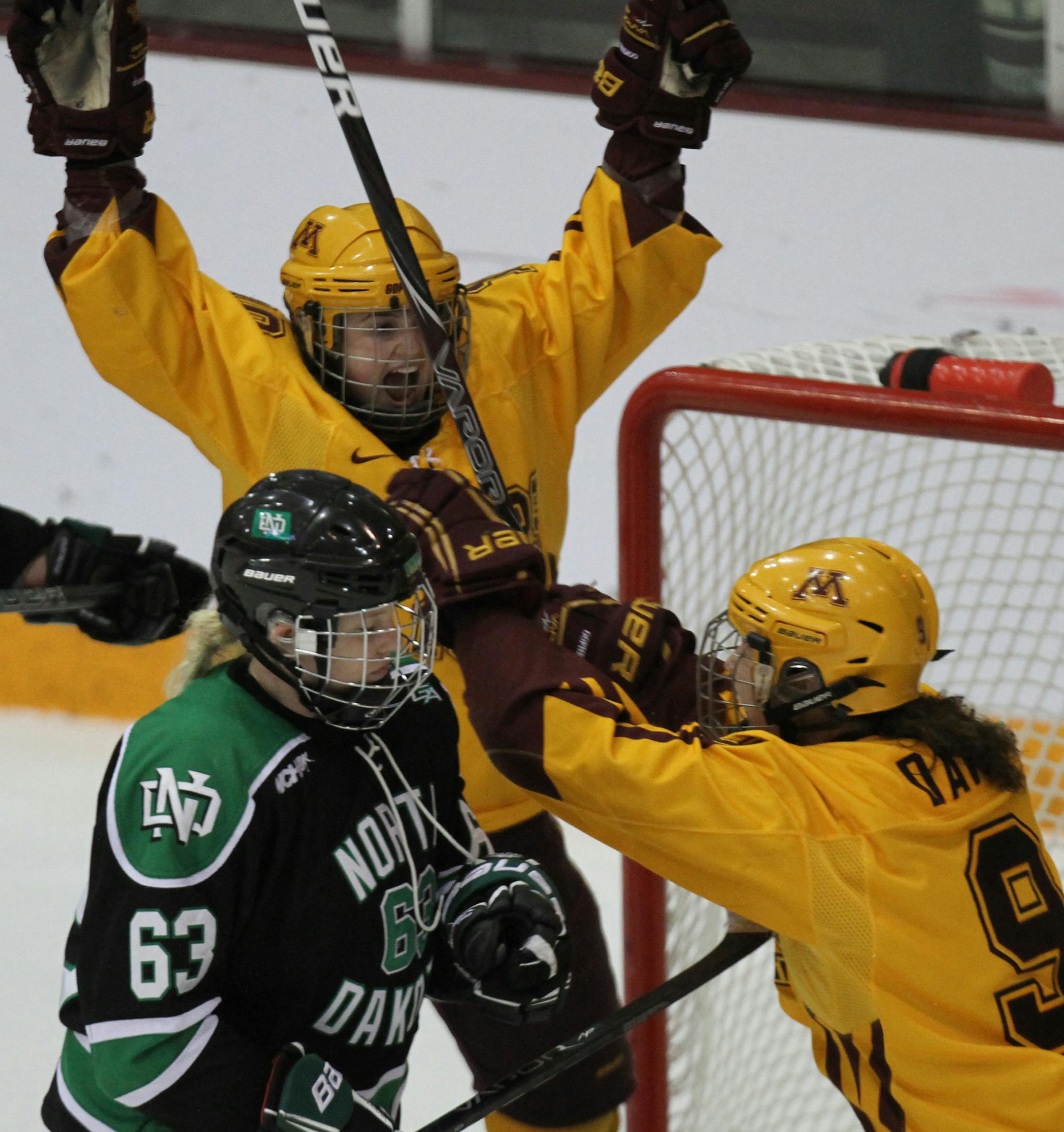 Gopher vs. North Dakota, Ridder Arena, 3/16/13. (left to right) The Gophers start their celebration after beating North Dakota in the 3rd overtime.] Bruce Bisping/Star Tribune bbisping@startribune.com
