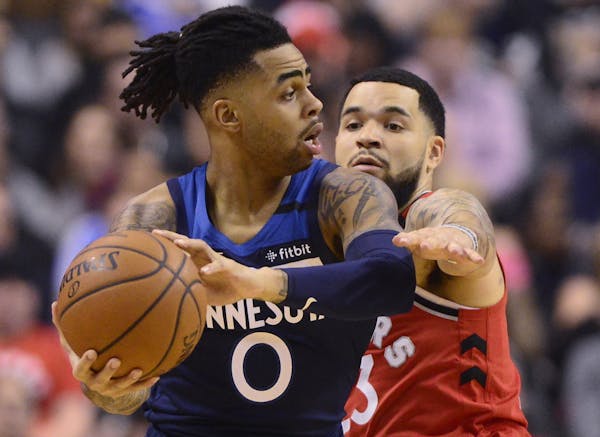 Timberwolves guard D'Angelo Russell shielded the ball from Raptors guard Fred VanVleet (23) during the first half Monday night.
