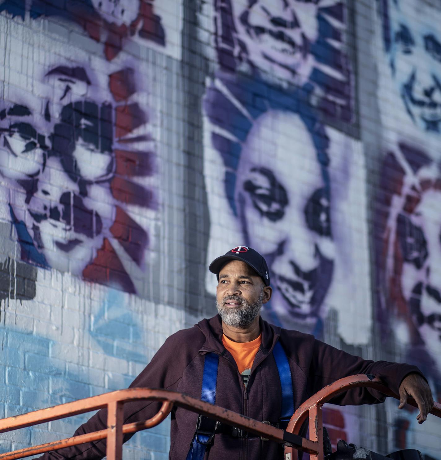 Profile of artist Peyton Scott Russell as he works on a elaborate mural at City of Lakes Community Land Trust that utilizes stencils that people created of themselves .] Jerry Holt •Jerry.Holt@startribune.com Profile of artist Peyton Scott Russell, who painted the massive George Floyd piece at 38th and Chicago. Russell is currently working on beautiful, elaborate mural at City of Lakes Community Land Trust that utilizes stencils that people created of themselves Thursday September 10,2020 in Min