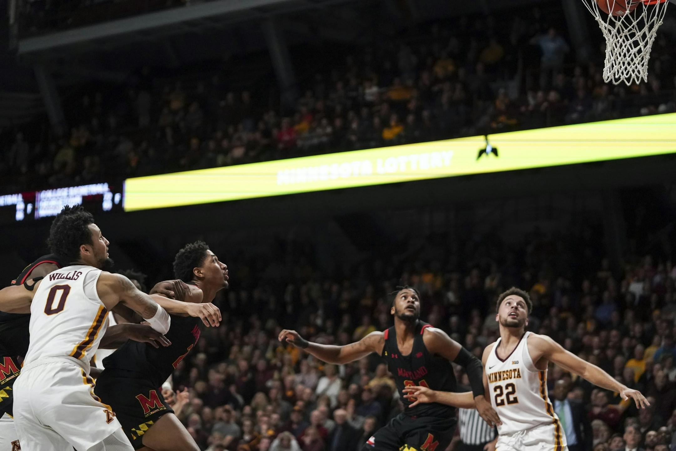 The players stopped to watch Maryland Terrapins guard Darryl Morsell's (11) three point shot go in the basket in the final seconds of the second half.