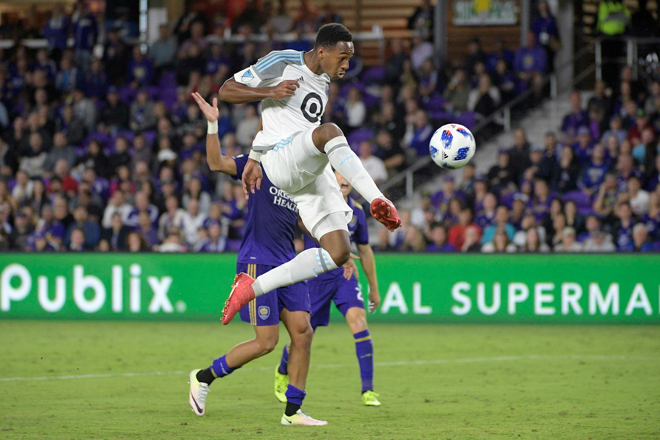 Minnesota United forward Mason Toye attempts a shot on goal in front of Orlando City defender Amro Tarek during the second half of an MLS soccer match Saturday, March 10, 2018, in Orlando, Fla. Minnesota won 2-1. (Phelan M. Ebenhack for the Star-Tribune) ORG XMIT: OTKMINN108