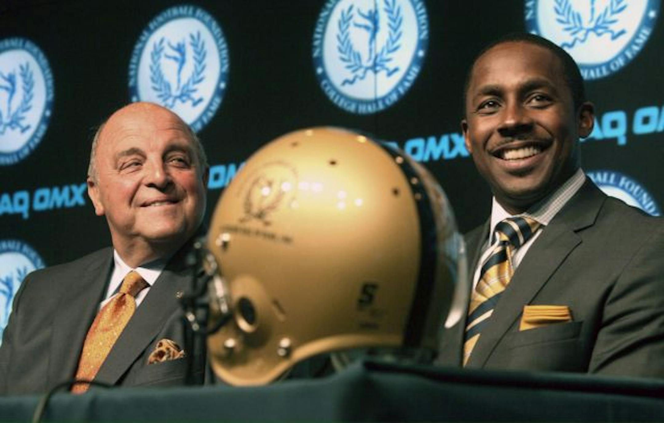 Wisconsin athletic director Barry Alvarez (left)