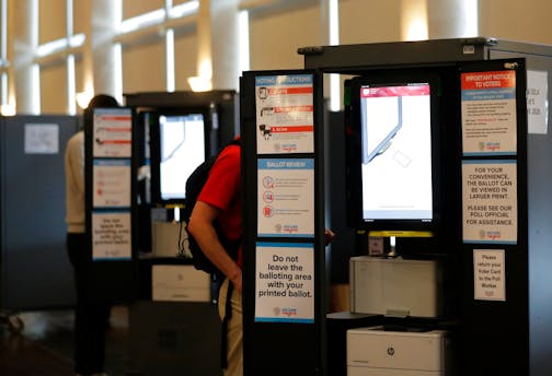 People vote at voting booths in the Georgia's primary election at Park Tavern on Tuesday, June 9, 2020, in Atlanta.