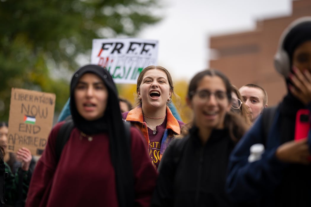 Kylie Miller, center, a University of Minnesota student who is Jewish, rallied with hundreds of people outside Coffman Memorial Union during a national student walkout in support of Palestine at the University of Minnesota in Minneapolis on Oct. 25, 2023.