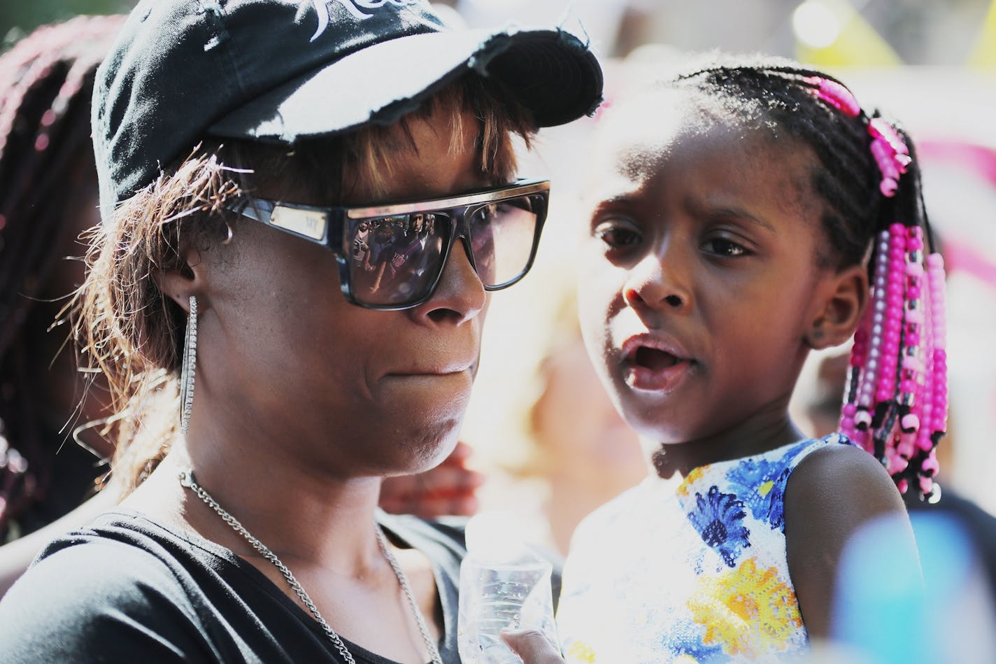 Diamond Reynolds, Philando Castile's girlfriend, holds her daughter Dae'Anna while speaking at a press conference regarding Castile's death during a traffic stop in Falcon Heights, Minn. on Wednesday, July 6, 2016.