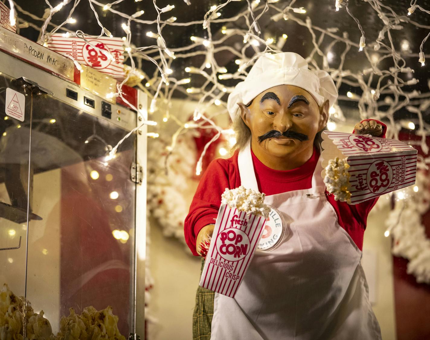 An animatronic elf raised and lowered a bag of popcorn on Tuesday December 3, 2019 atop the popcorn stand in Bentleyville. ]
ALEX KORMANN &#x2022; alex.kormann@startribune.com Bentleyville in Duluth, MN has the old Dayton's animatronic figures on display in faux TV sets and above their popcorn stand. These animatronics are favorites of people that visit the Christmas lights display.