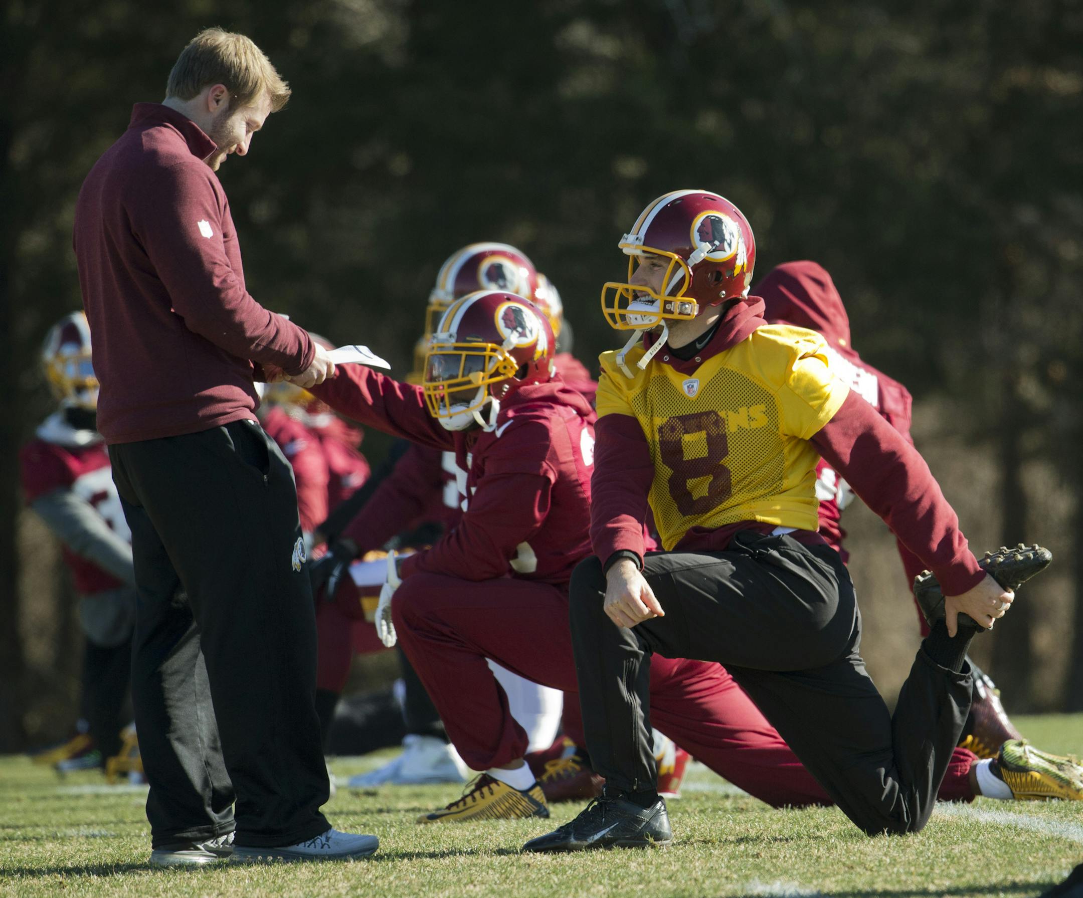 Washington Redskins offensive coordinator Sean McVay, left, talks to quarterback Kirk Cousins (8), during an NFL football team practice at Redskins Park in Ashburn, Va., Wednesday, Jan. 6, 2016. (AP Photo/Manuel Balce Ceneta)