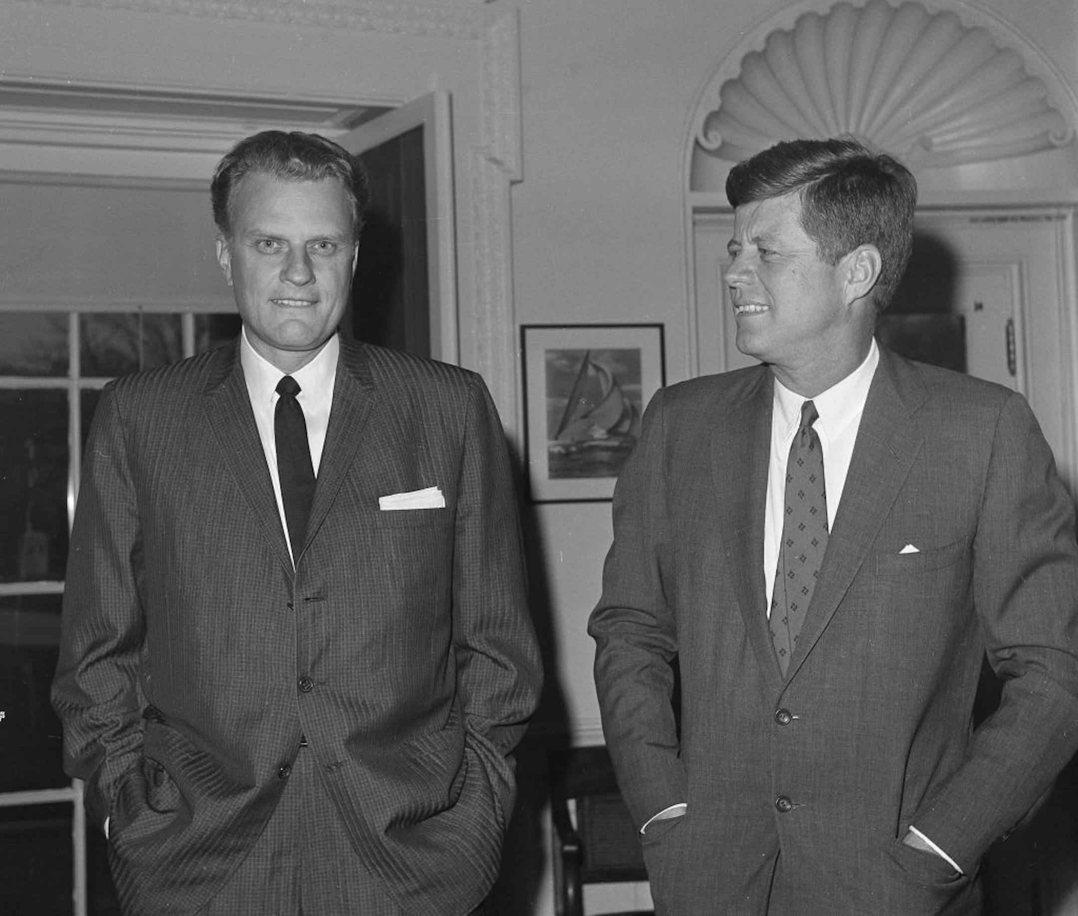 Dec. 12, 1961: Billy Graham, left, talks with President John F. Kennedy during a call at the the White House in Washington.