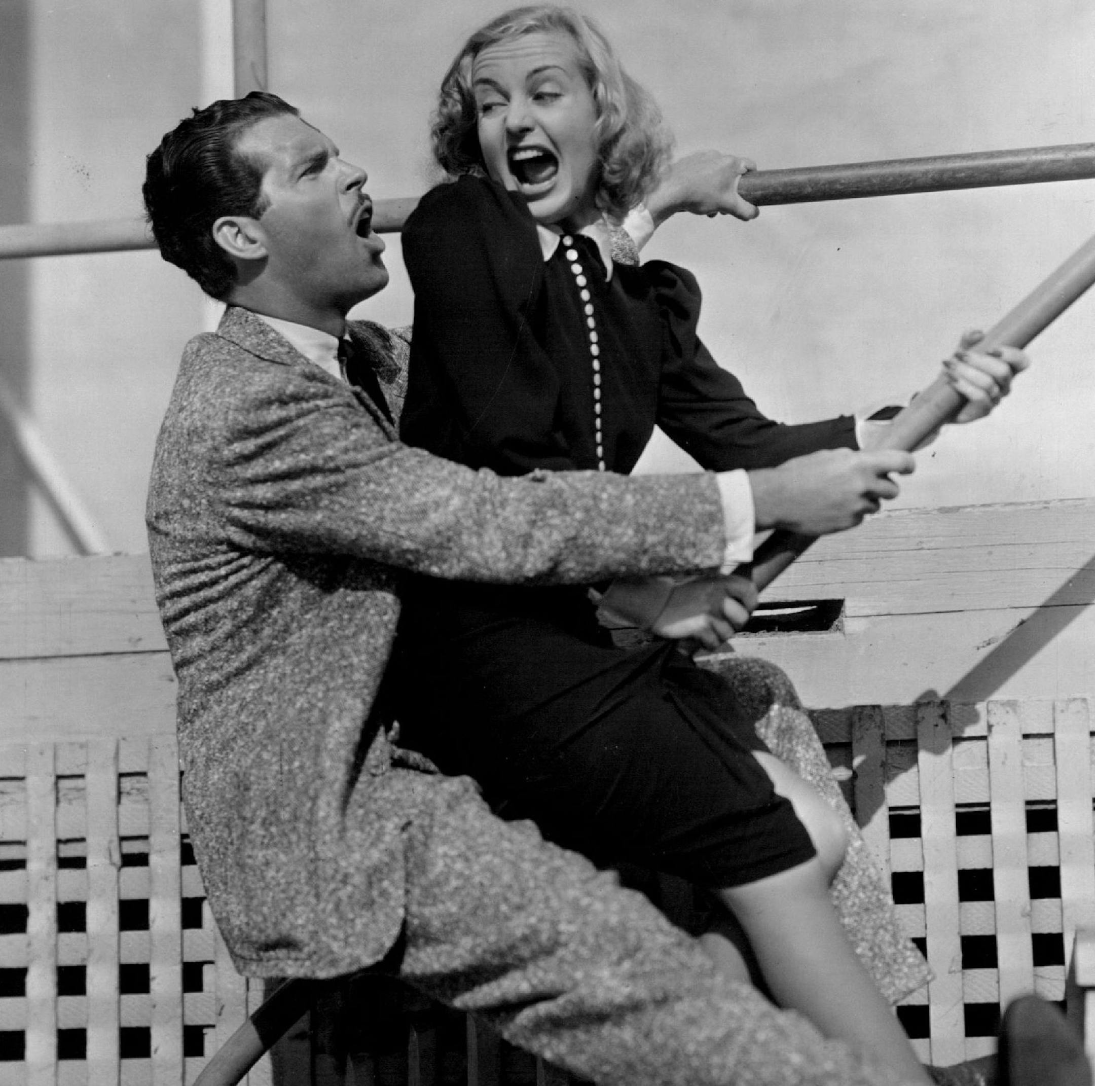 Carole Lombard, Fred MacMurray and Hohn Barrymore in "True Confession" With Una Merkel Porter Hall Edgar Kennedy, Fritz Feld and Toby Wing. Cutting Up - it's fun being a movie star-or at least Carole Lombard and Fred MacMurray seen to find it fun as they indulge in some off-stage cavorting between scenes of Paramount's "True Confession." Others in the pictures's cast are John Barrymore, Una Merkel, Porter Hall and Edgar Kennedy. Wesley Ruggles is directing. Fred MacMurray and Carole Lombard in "