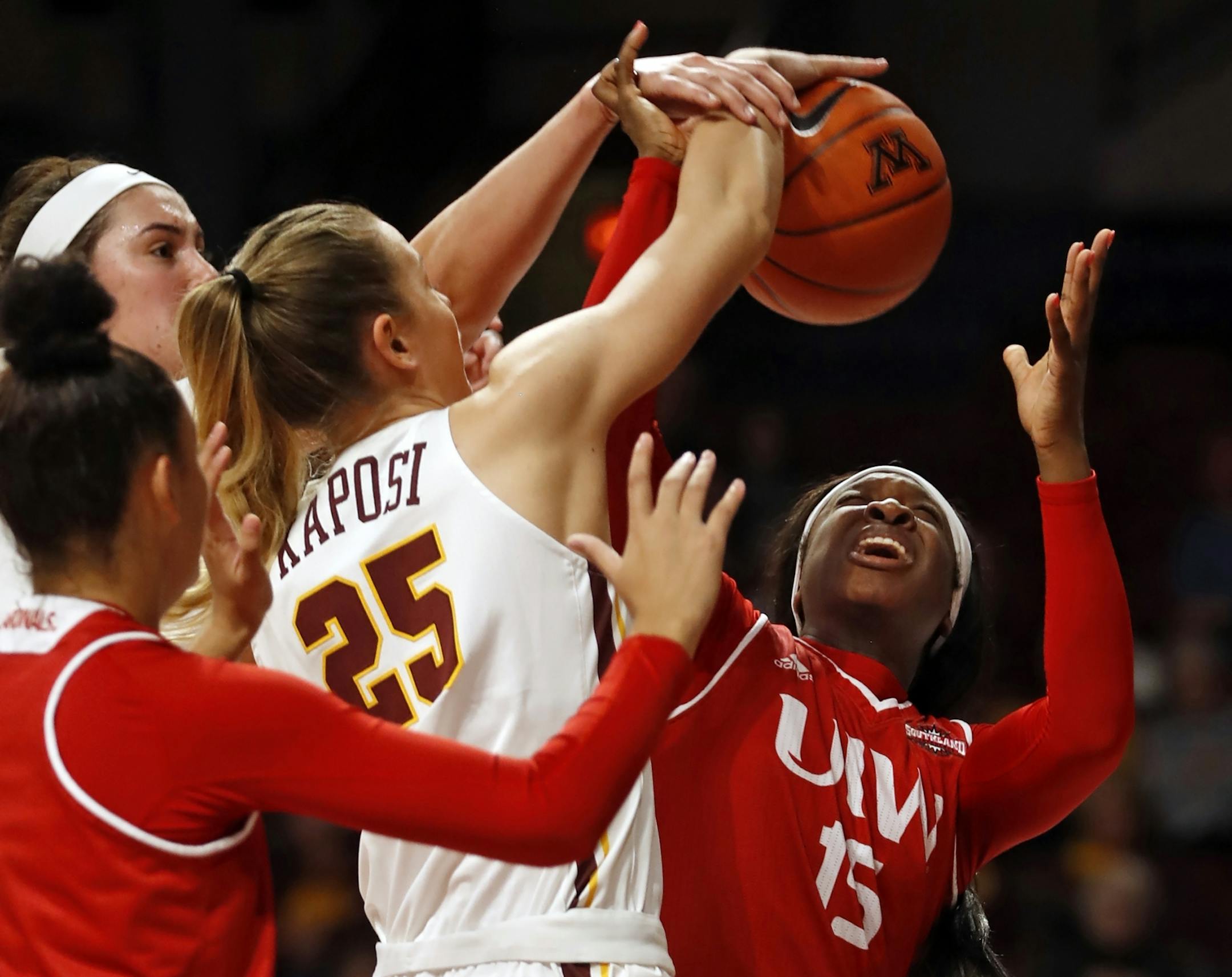 Gophers Palma Kaposi(25) and Starr Omozee(15) tangle.