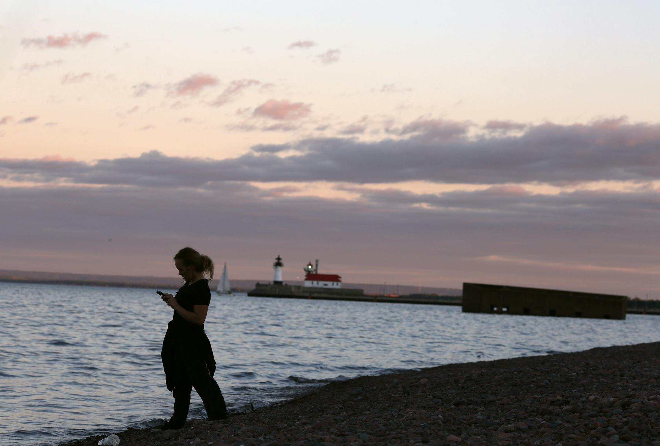 A woman picked rocks from the shoreline of Lake Superior Tuesday August 26, 2015 in Duluth, MN. A profile on the resurgence of Duluth. ] Jerry Holt/ Jerry.Holt@Startribune.com