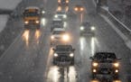 Morning traffic moves on Interstate 94 eastbound in St. Paul during the March 25 snowstorm in Minneapolis.