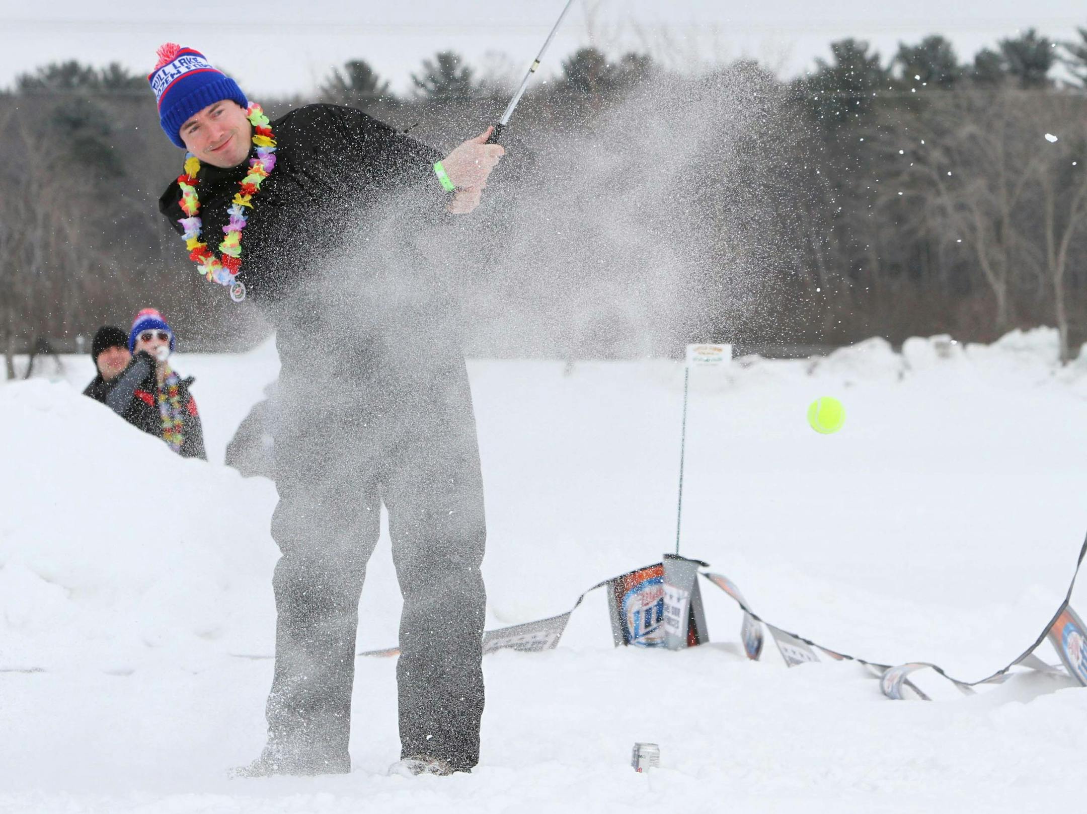 Golfers try their hand at snow golf, Saturday, Feb. 23, 2013, on Hole-in-the-Day Bay during the annual Gull Lake Frozen Fore in Nisswa, Minn. (AP Photo/Brainerd Dispatch, Kelly Humphrey) ORG XMIT: MIN2013040313330660