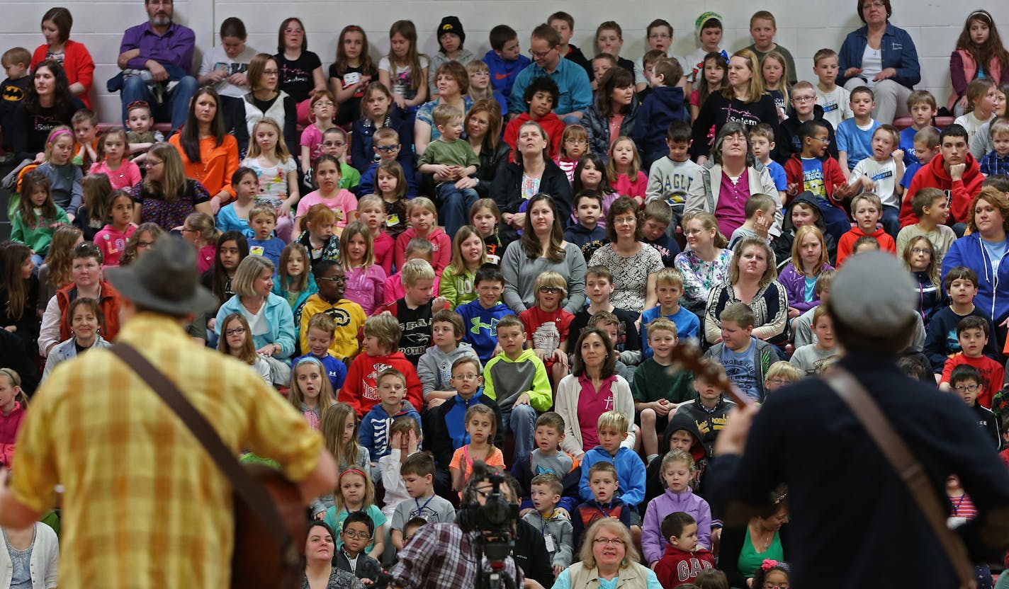 (left to right) The Okee Dokee Brothers, Joe Mailander and Justin Lansing performed at the St. Croix Lutheran School, on 4/11/14. Several hundred twin cities children from pre-school to 4th grade attended the concert by the Grammy winning kids-music stars, the Okee Dokee Brothers.] Bruce Bisping/Star Tribune bbisping@startribune.com Justin Lansing, Joe Mailander/source.