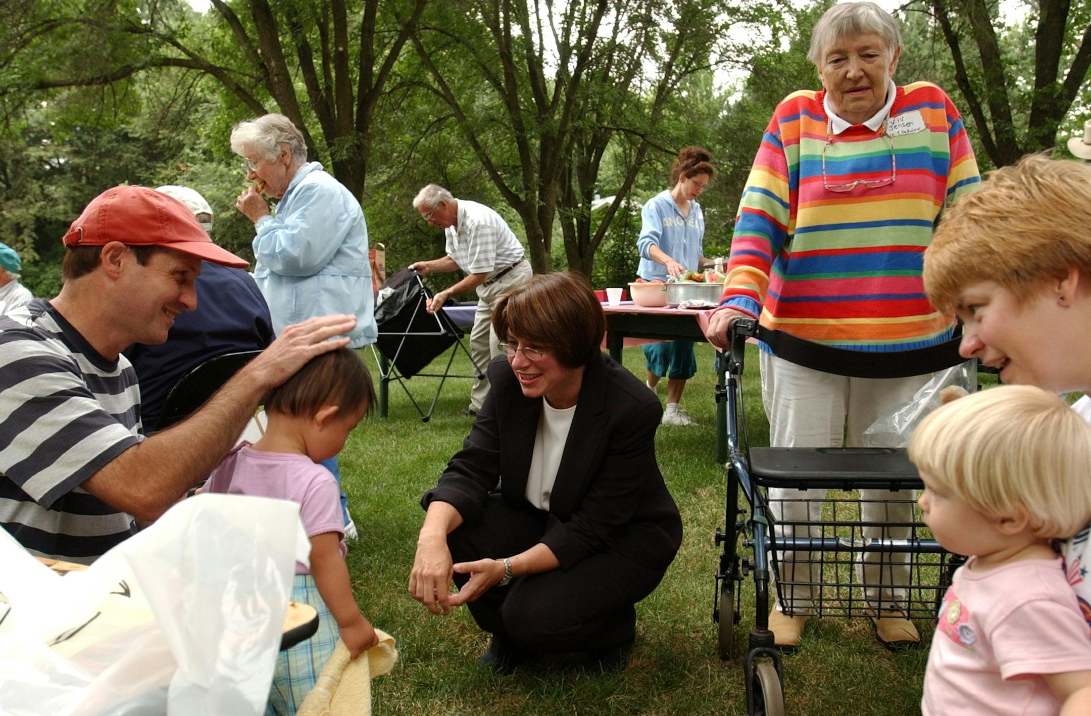 Hennepin County Attorney Amy Klobuchar takes part National Night Out activities in Plymouth. She is pictured with her husband. Name to follow