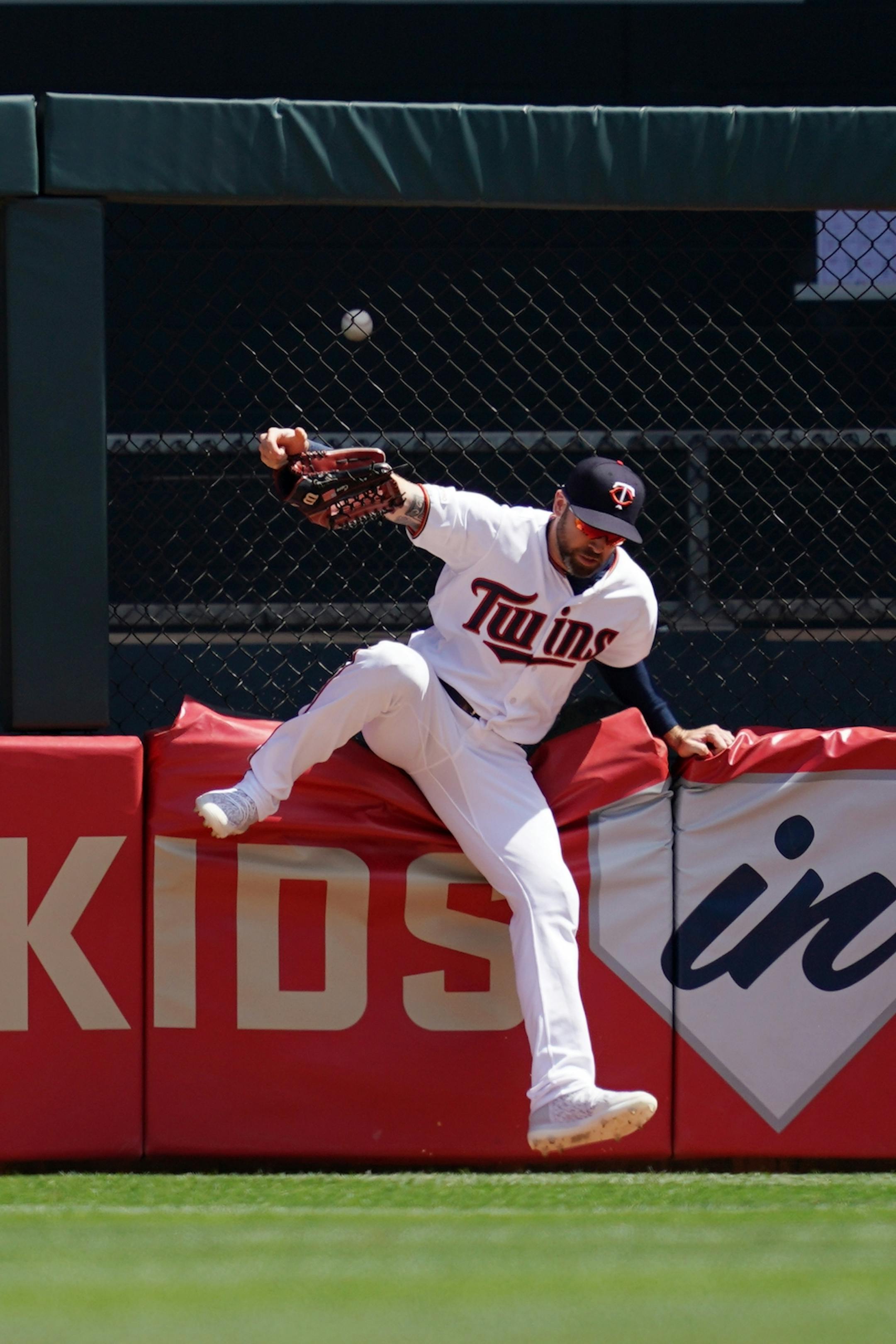 Minnesota Twins center fielder Jake Cave (60) leapt but was unable to field a solo home run hit by Atlanta Braves first baseman Freddie Freeman (5) in the first inning.