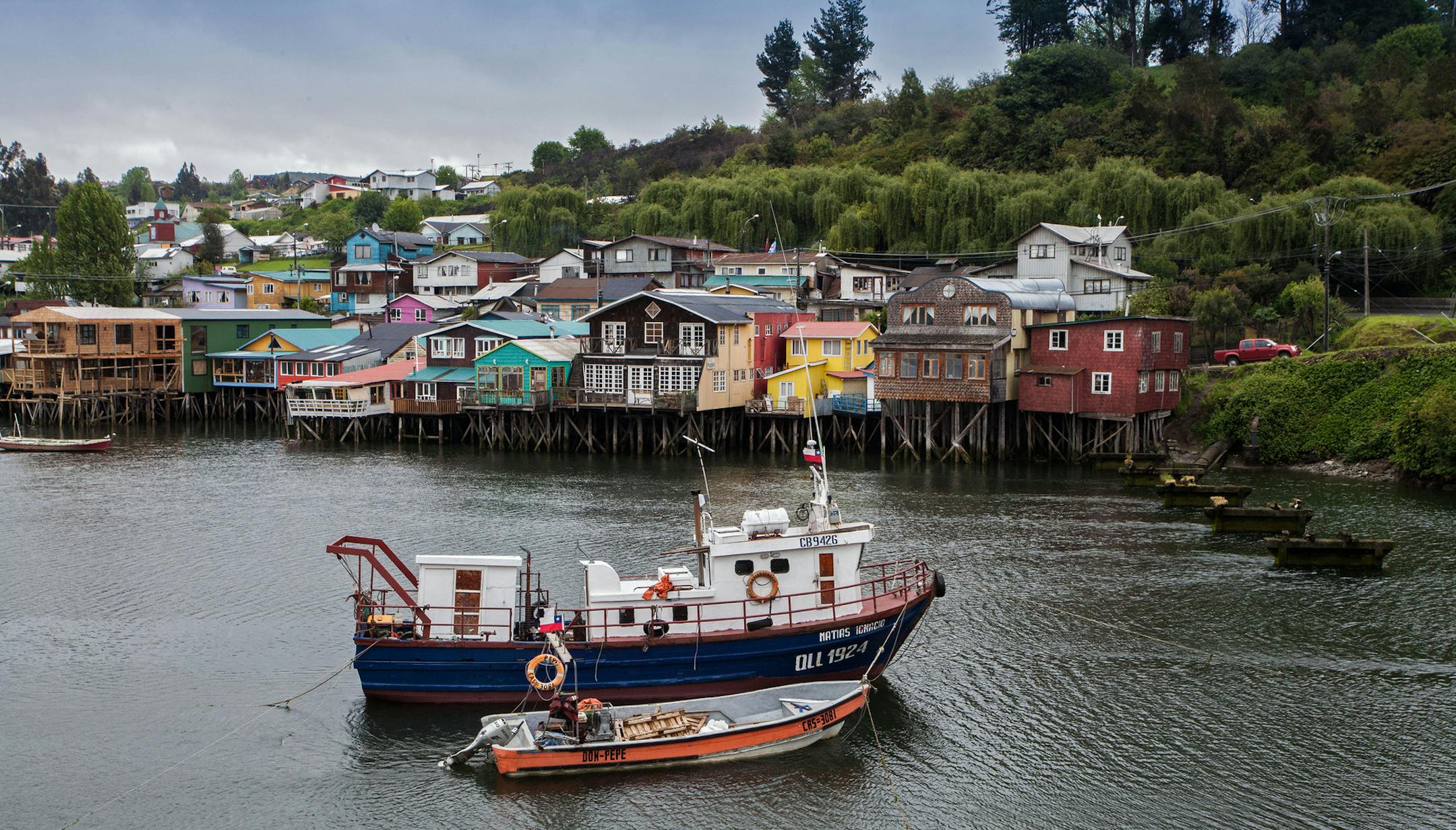 "Palafitos," wooden stilt houses, some centuries old, line the west shore of Fiordo de Castro bay in Chiloe, Chile. (Steve Haggerty/ColorWorld/TNS) ORG XMIT: 1163824