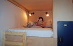 Hostel du Nord assistant manager Marguerite Bennett sits in a double-bunk bed at the hostel, set to open later this month.