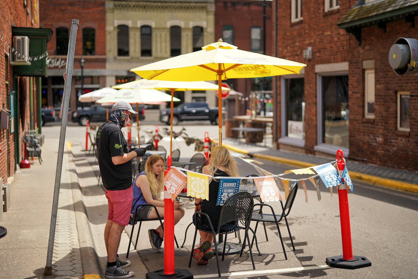 Dawn Hall and her daughter Sophia were Nacho Mama's first seated customers since the pandemic started. The restaurant was allowed expanded seating along Nelson St. Stillwater.