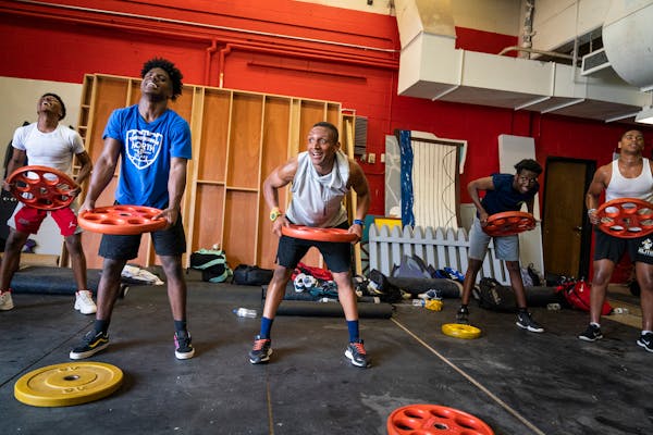 The Minneapolis North High School football team worked out during the first available day of summer workouts in the Minneapolis North High School weig