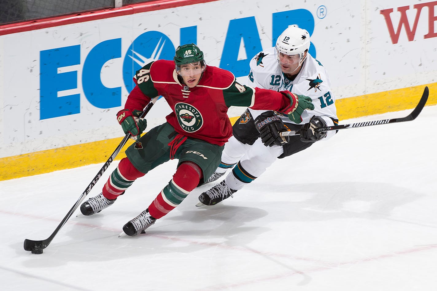 Minnesota Wild defenseman Jared Spurgeon (46) skates behind Minnesota's goal trailed by San Jose Sharks center Patrick Marleau (12) during the second period Tuesday. ] (Aaron Lavinsky | StarTribune) The Minnesota Wild take on the San Jose Sharks Tuesday, Jan. 6, 2014 at Xcel Energy Center in St. Paul.